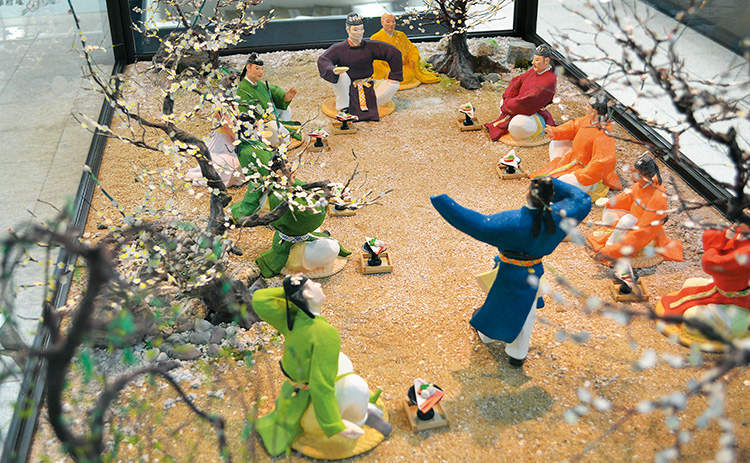 梅花の宴を博多人形で表現している写真